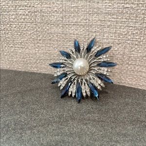 Rhinestone and blue gemstone brooch